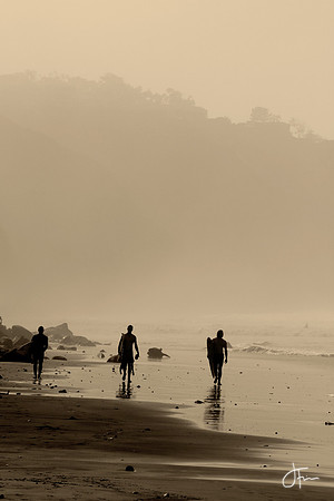 Three Surfers